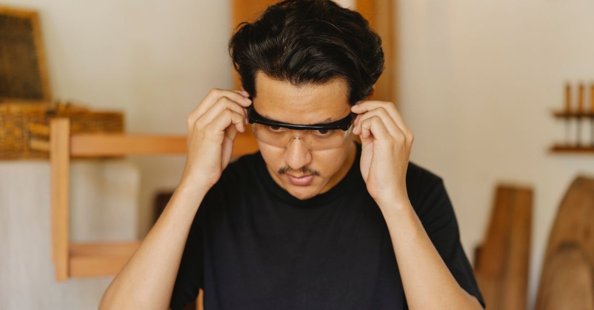 Samsung and Google Prep Smart Glasses as Meta's Sales Double, Backed by New Qualcomm and MediaTek Silicon Young attentive ethnic male joiner in casual wear putting on carpentry glasses while looking down in workroom