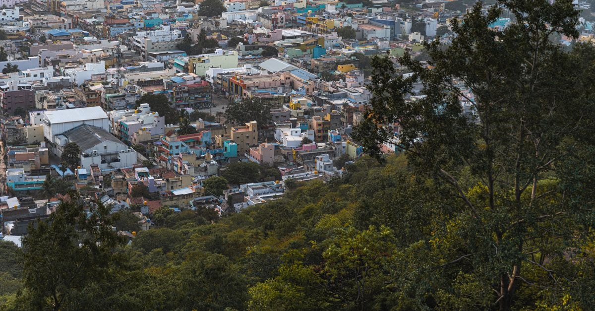 Hotel CAG Pride in Coimbatore: A Business-Class Stay on Bharathiyar Road Breathtaking aerial view of Tiruvannamalai cityscape surrounded by lush greenery.