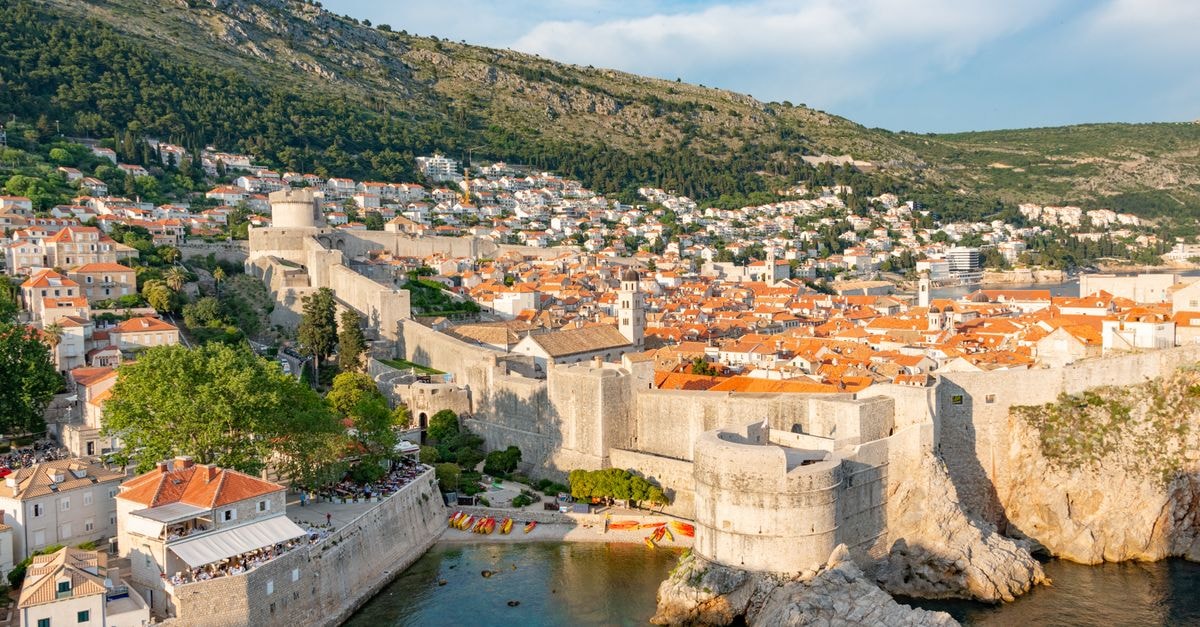 Aerial view of Dubrovnik's historic Old Town and defensive walls along the Adriatic Sea.
