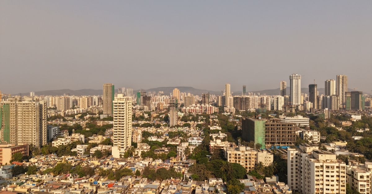 OYO 63010 Godavari Lodge, Nanded — A Central Stop on Vazirabad Road Stunning aerial view of Mumbai's skyline highlighting modern skyscrapers under clear skies.