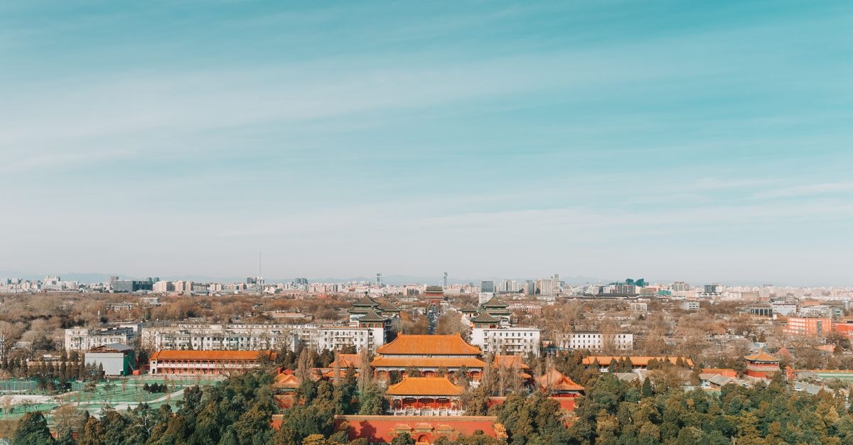 Hampton by Hilton Chengde Mountain Resort: A 2021 Addition Near the Imperial Garden Stunning aerial view of Beijing's Forbidden City amidst urban skyline, capturing historic architecture and modern buildings.