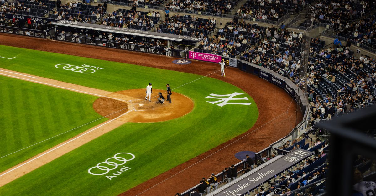 MLB trade deadline looms as injuries reshape Yankees, Dodgers and contender plans Aerial view of a baseball game at Yankee Stadium with a packed crowd.