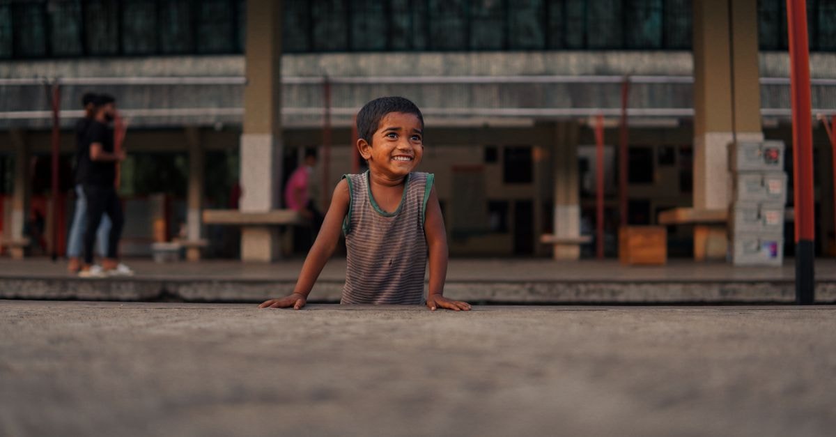 Prime Video's Adarsh Baal Vidyalaya Tops Global Non-English Charts as The Boys Returns to U.S. Top 10 A smiling child in a tank top stands outdoors in an urban setting in Sylhet, Bangladesh.