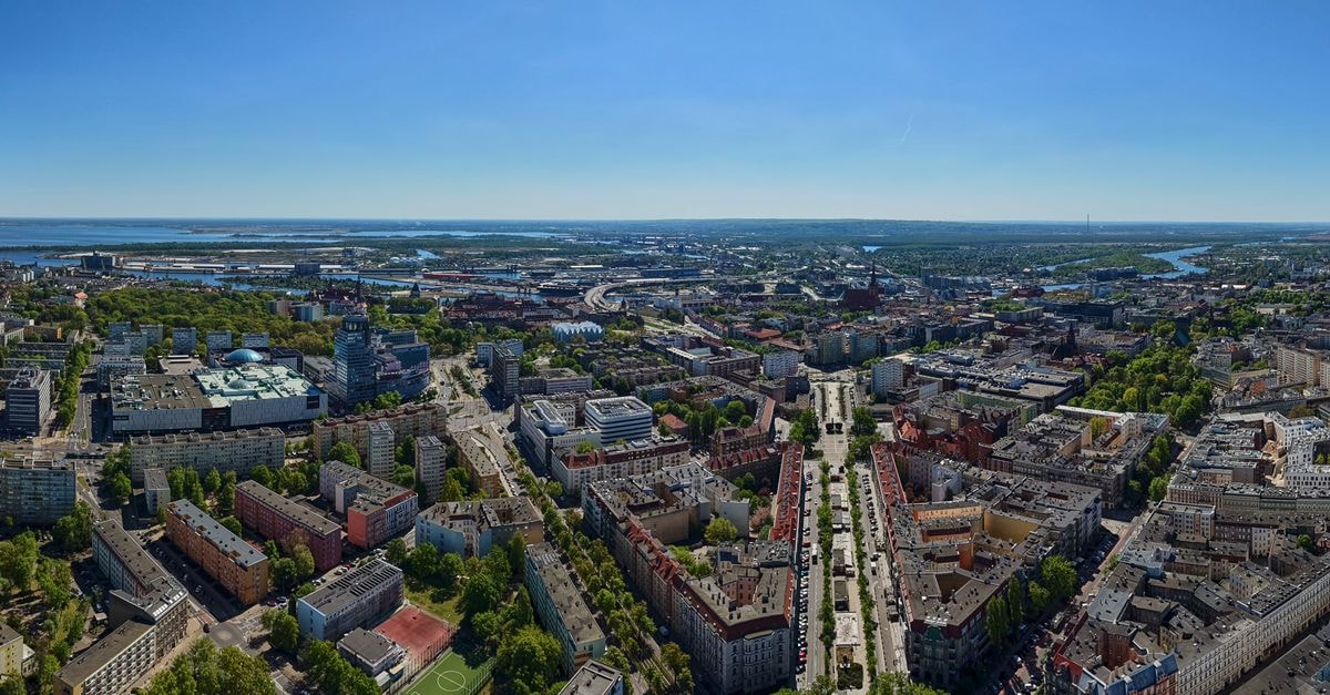 Victoria, Pärnu — A Historic Small Hotel in the Heart of the Old Town Panoramic aerial view of Szczecin, Poland, showcasing urban architecture and wide avenues on a bright summer day.