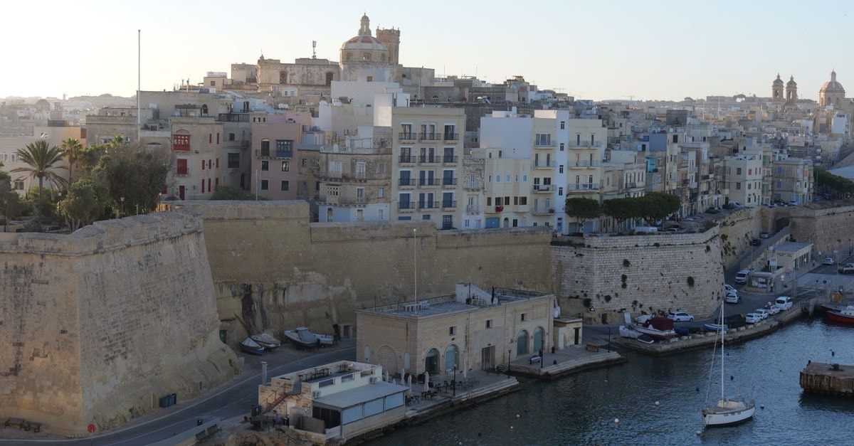 The Barrister Hotel, Valletta — A 17th-Century Boutique Retreat in Malta's Capital A stunning aerial view capturing Valletta's historic architecture and coastal skyline at dusk.