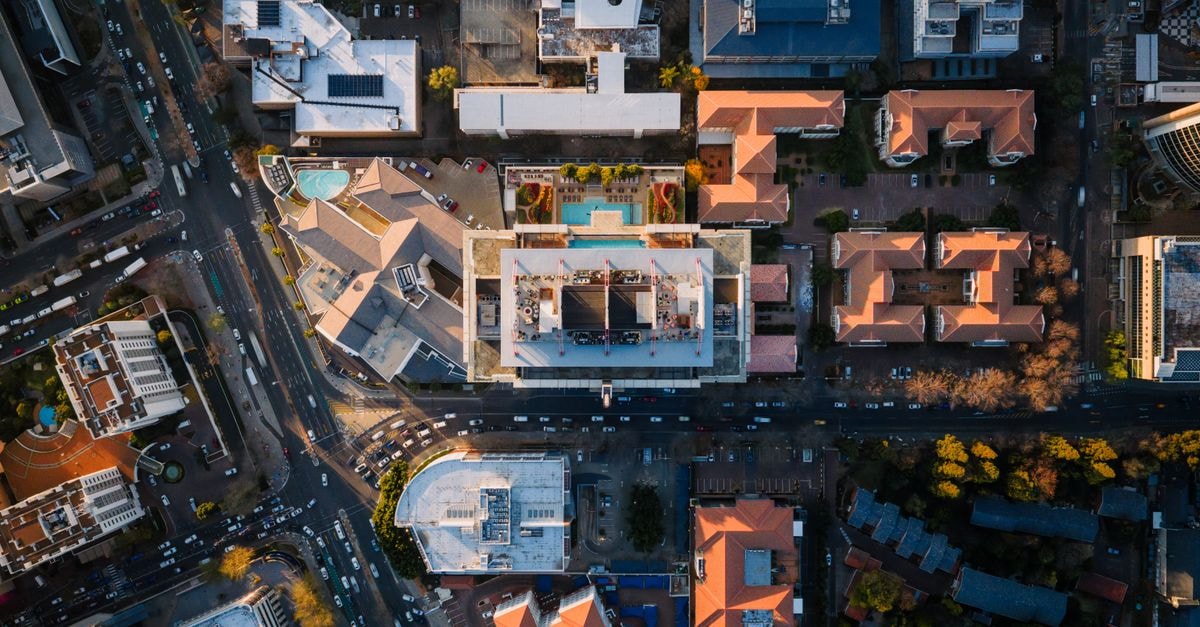 Hyatt Regency Harare The Meikles: A 1915 Landmark Reopens Under the Hyatt Flag Stunning aerial shot of Sandton's urban landscape showcasing modern architecture, roads, and rooftop pools.