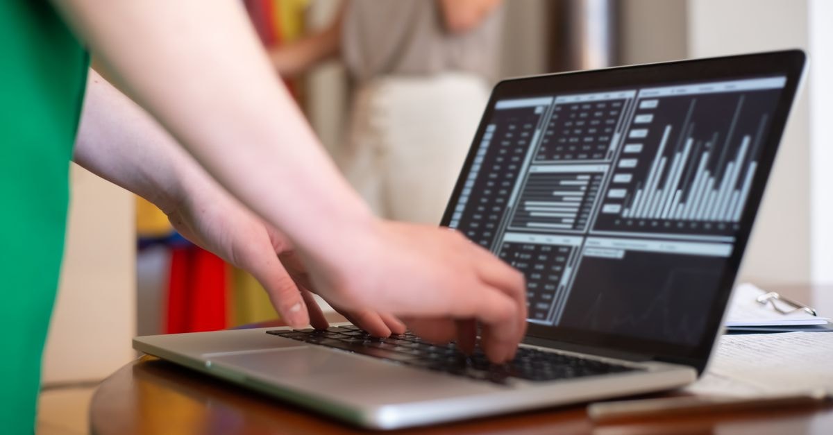 ServiceNow warns of three maximum-severity vulnerabilities as PaperCut zero-day and McKesson breach add to a heavy cybersecurity day Hands typing on a laptop displaying data charts in an indoor setting.