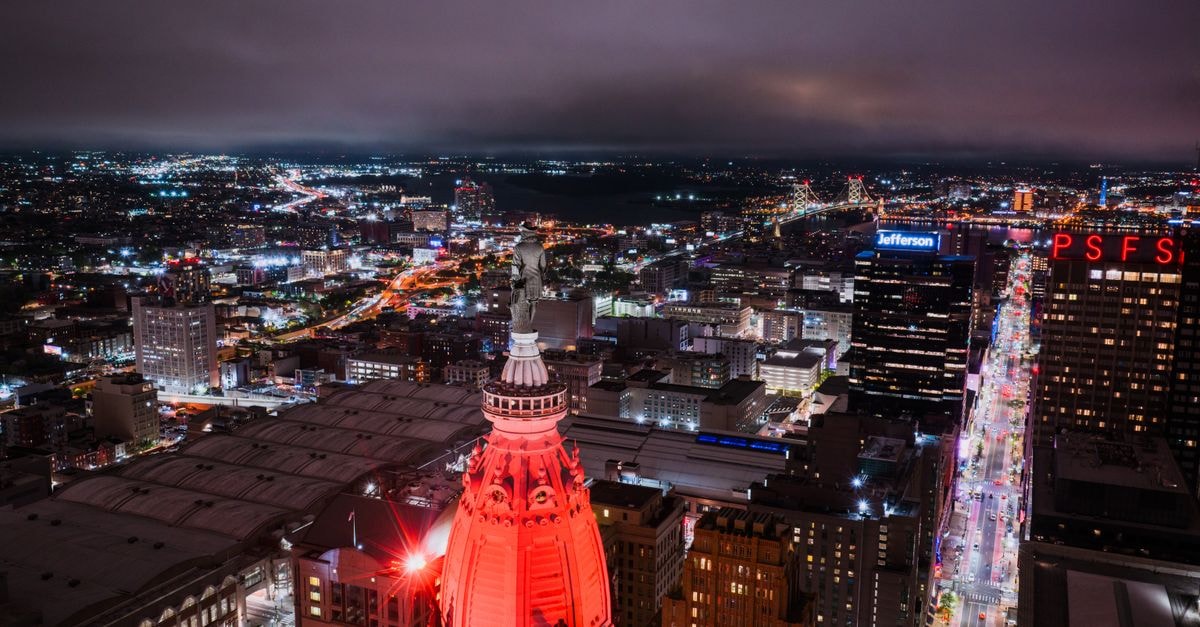 DoubleTree by Hilton Jefferson City: Penthouse Dining Over Missouri's Capital Stunning aerial view of Philadelphia skyline at night showcasing bright city lights and landmarks.