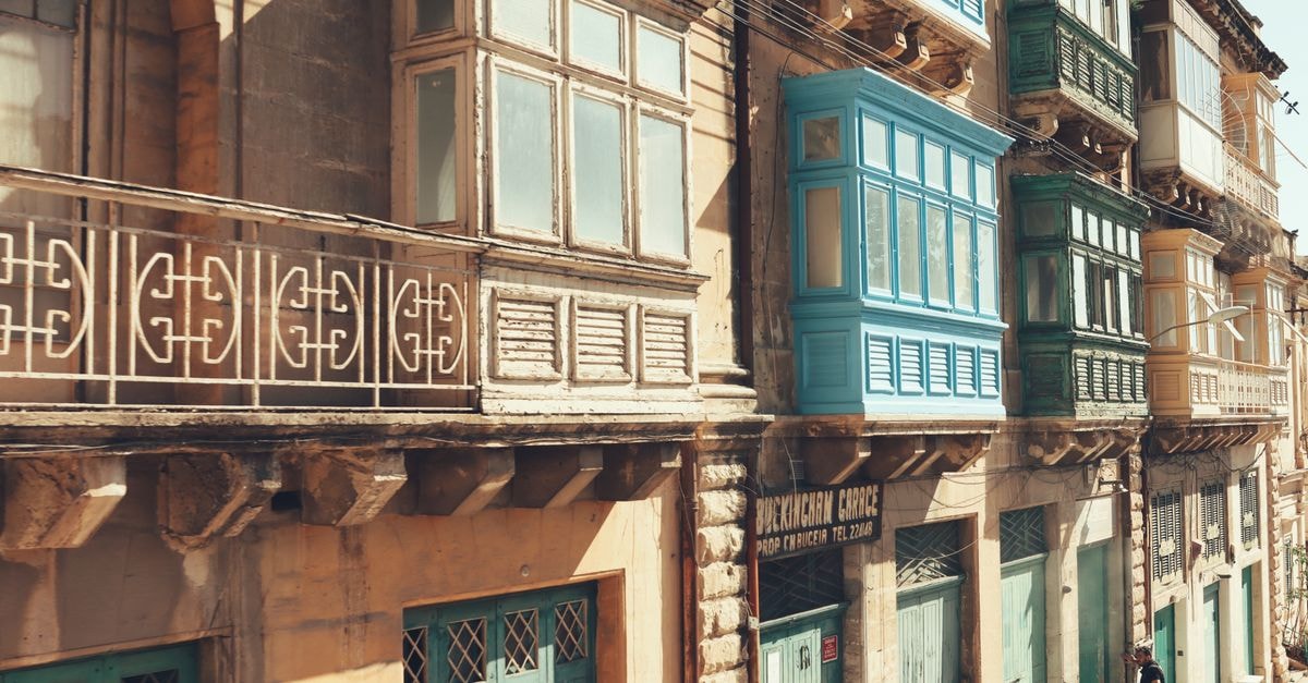 Naxxar travel guide: a quiet Maltese town with a regal heart Charming traditional Maltese balconies in Valletta, showcasing iconic architectural style.