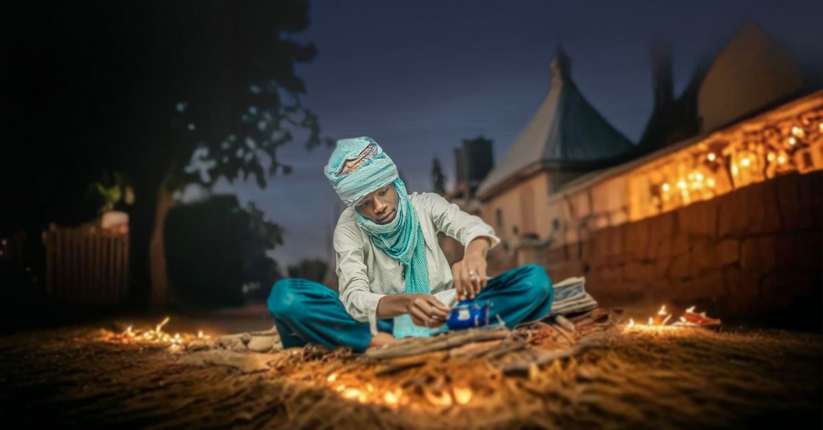 Damaturu Travel Guide: A Calm Look at Yobe's Capital A traditional vendor prepares goods at night in Damaturu, Nigeria.