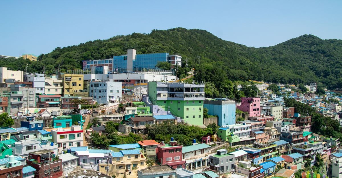 Gapyeong 101 Pool Villa in Gapyeong: Private Full-Villa Retreat A vibrant aerial view of Busan's Gamcheon Culture Village with colorful houses and lush hills.
