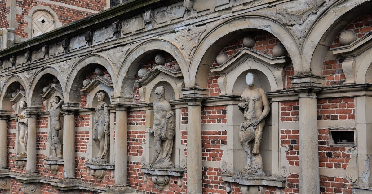 Danhostel Hillerød, Hillerød — A Family-Friendly Base by Store Dyrehave Detailed view of historic stone statues at Frederiksborg Palace, Hillerød, Denmark.