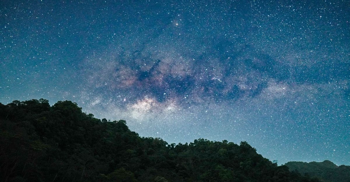 Jepara Indah Hotel International in Jepara: Central City Base with On-Site Pool and Restaurant Stunning night view of the Milky Way over lush hills in Jepara, Indonesia.