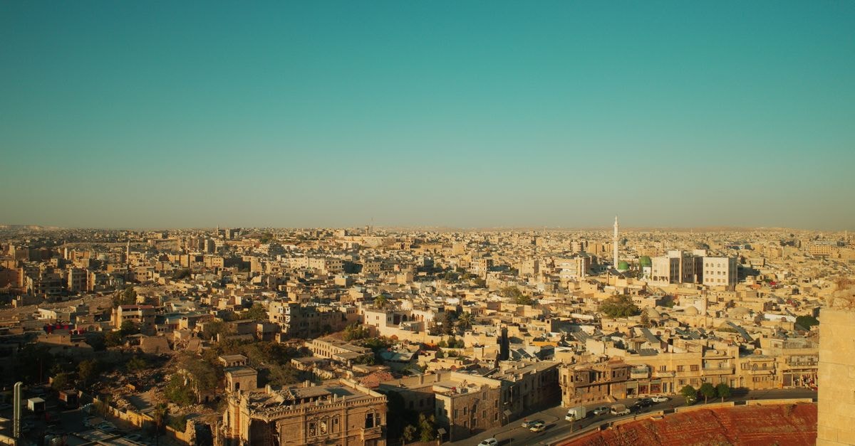 Haske Luxury Hotel, Minna — A Premium Stay on Shehu Kangiwa Road Stunning aerial view of Aleppo's historic architecture under a clear blue sky.