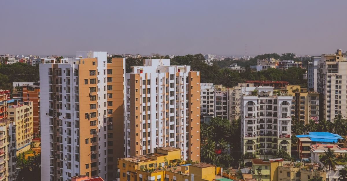 Hotel Reliance, Bokaro — A Centrally Located Stay in Steel City A vibrant cityscape featuring modern residential high-rise buildings in daylight.