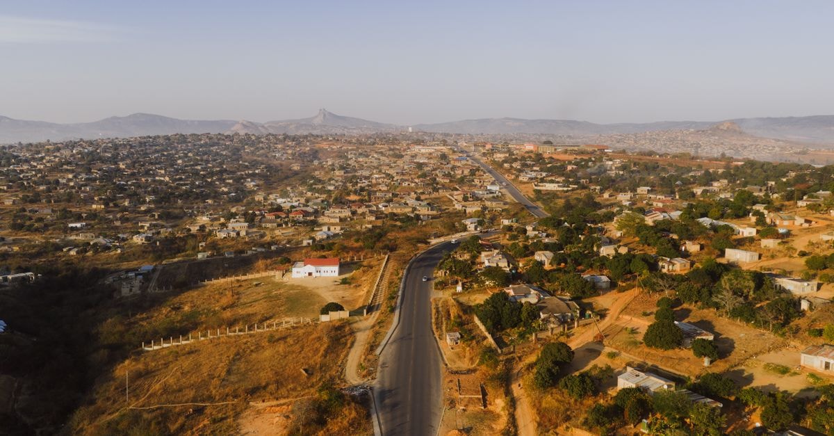 Kabwe travel guide: history, sights and local tips Aerial panorama of Phola township showcasing sunlit houses, roads, and hills in South Africa.