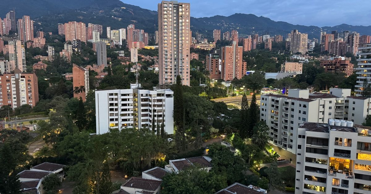 History Center Hotel Medellín: A 3-Star Stay in the Historic Heart A captivating view of the Medellín skyline at sunrise, showcasing the city's urban and natural landscapes.