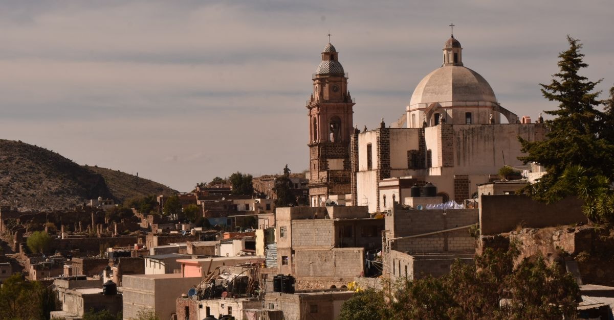 Ciudad Benito Juarez Travel Guide: History, Culture, and Local Rhythm Panoramic townscape featuring historic church in Real de Catorce, S.L.P., México.