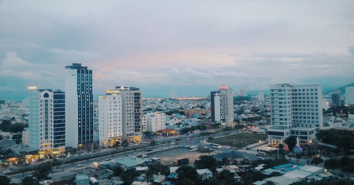 Hotel Montemar in Azua: A Practical Stop on Avenida Juan Pablo Duarte Stunning aerial view of a modern urban skyline with skyscrapers at dusk, capturing city lights and architecture.