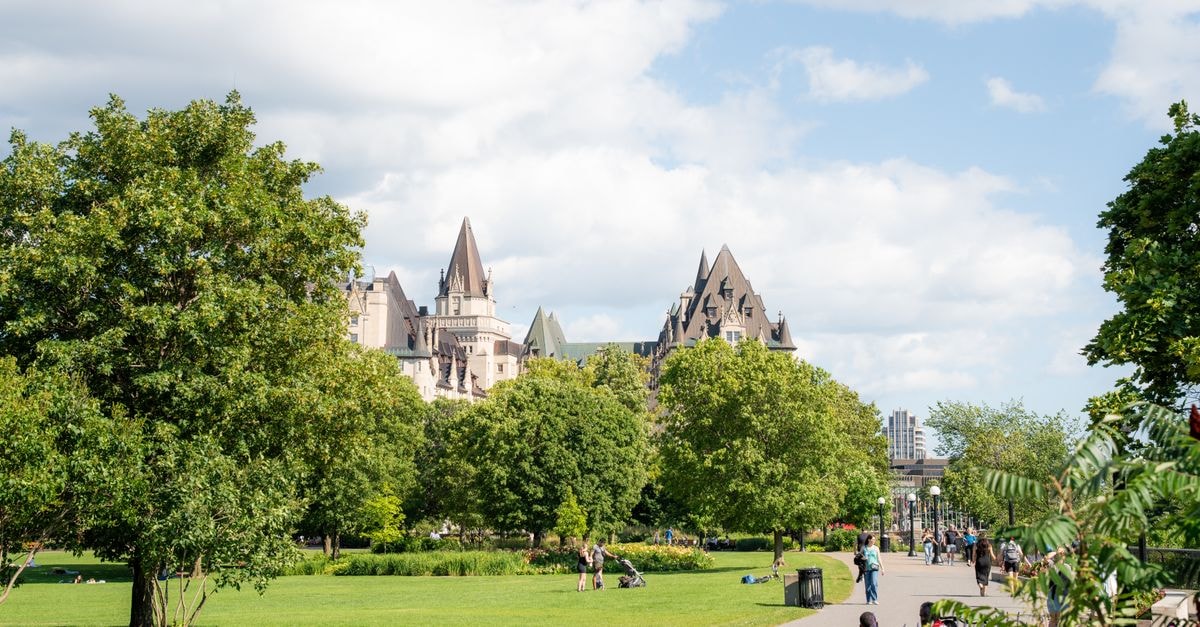 Homewood Suites Ottawa Downtown, Ottawa — River Views Near the Locks Sunny view of Château Laurier from Major's Hill Park, Ottawa with lush greenery in summer.
