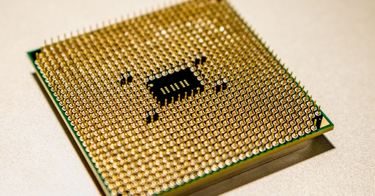 Alibaba unveils Zhenwu V900 chip and Qwen roadmap targeting up to 10 trillion parameters Detailed close-up of a golden microprocessor chip, ideal for technology concepts.