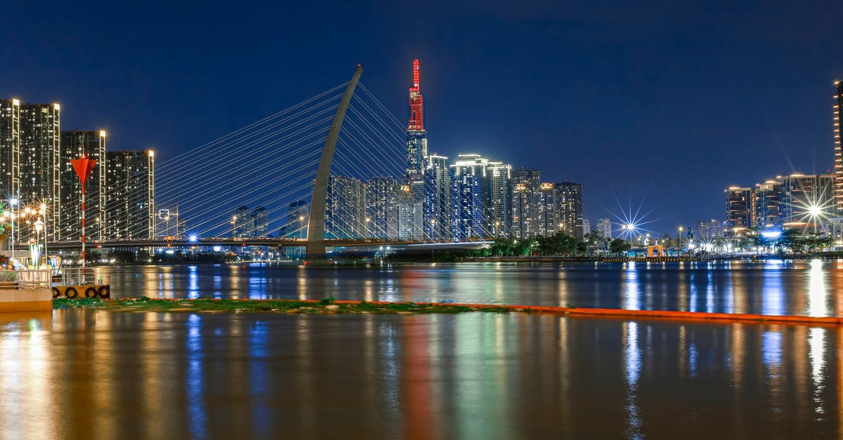 Tru by Hilton Viet Tri City Centre in Viet Tri: A Lively Lobby on Hùng Vương Night view of the illuminated Ba Son Bridge with city skyline in Ho Chi Minh City, Vietnam.