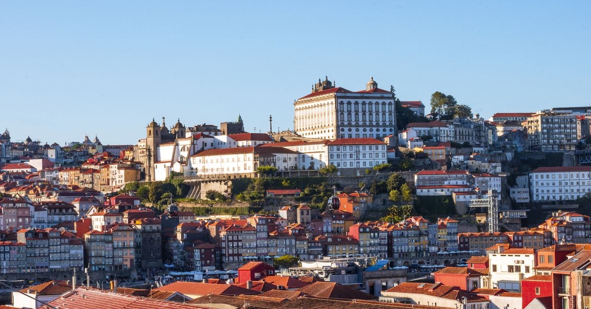 Hotel El Greco in Pátrai: Central Base Near Bus, Train and Port Beautiful aerial view of Porto, Portugal showcasing historic buildings and red rooftops.