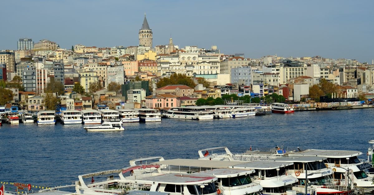 LeVor Hotel in Nilüfer, Bursa: A Gorukle Address on Eymir Caddesi Boats docked near Istanbul's iconic Galata Tower with cityscape backdrop.
