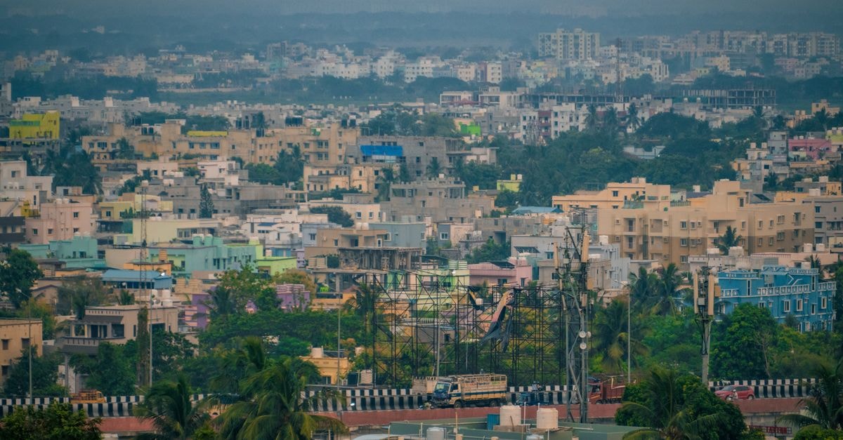 Signature Hotels in Visakhapatnam: A Practical Stop on NH-16 Aerial view of Bhubaneswar's colorful buildings and lush greenery, showcasing urban life in India.