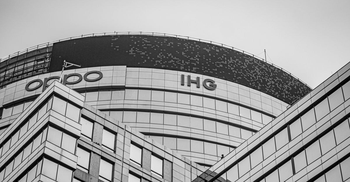 Gurugram Travel Guide: A Modern City With an Older Spine Black and white photo of a modern office building in Gurugram with glass facade and unique architecture.