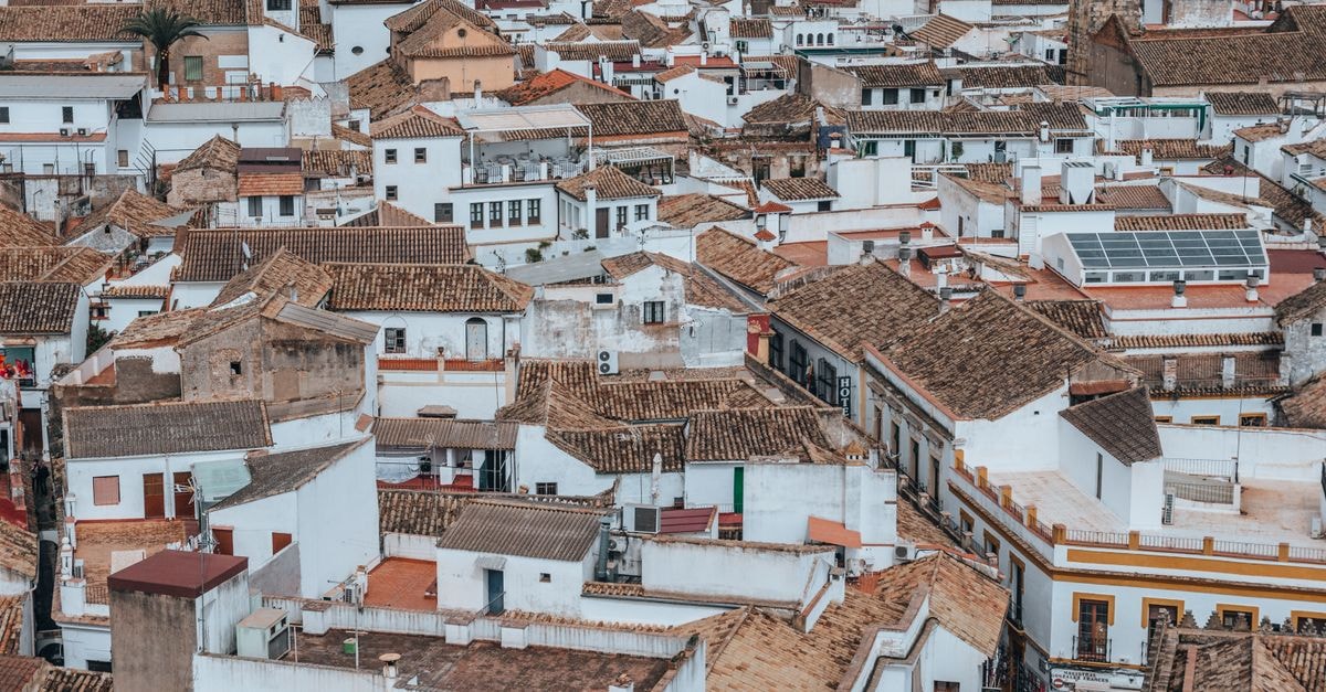 Hostal La Fuente, Cordoba — A 19th-Century Patio Guesthouse A stunning aerial view of Córdoba's traditional architecture with rustic rooftops showcasing Spanish culture.