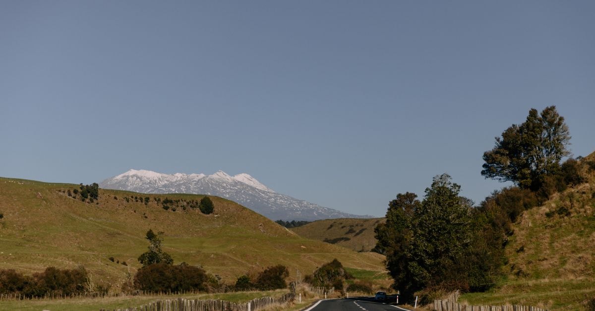 Slow Days on the Kwilu: A Grounded Travel Guide to Kikwit Peaceful road trip to Mount Ruapehu in New Zealand with scenic winter landscape views.