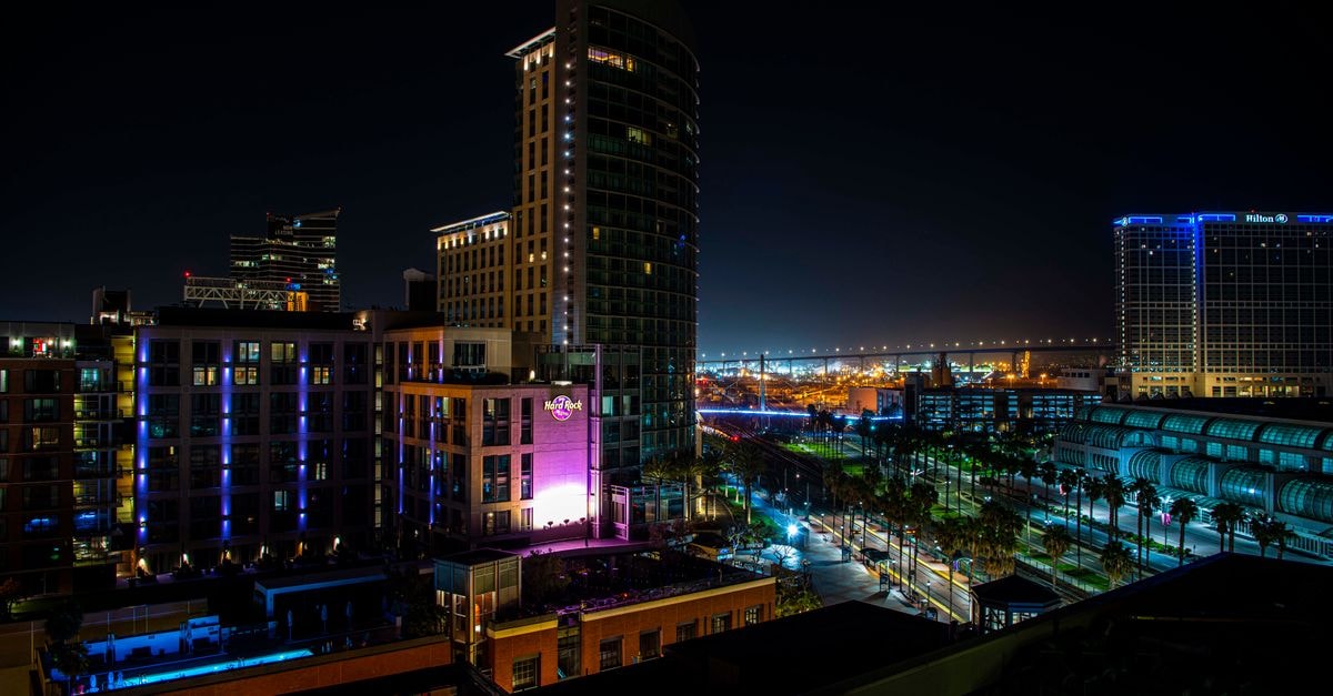 Hotel San Diego in Asunción: A Central City Base A lively nighttime cityscape featuring vibrant lights and modern architecture in San Diego.