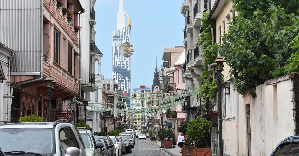 Charming street in Batumi, Georgia, featuring the iconic Alphabetic Tower.