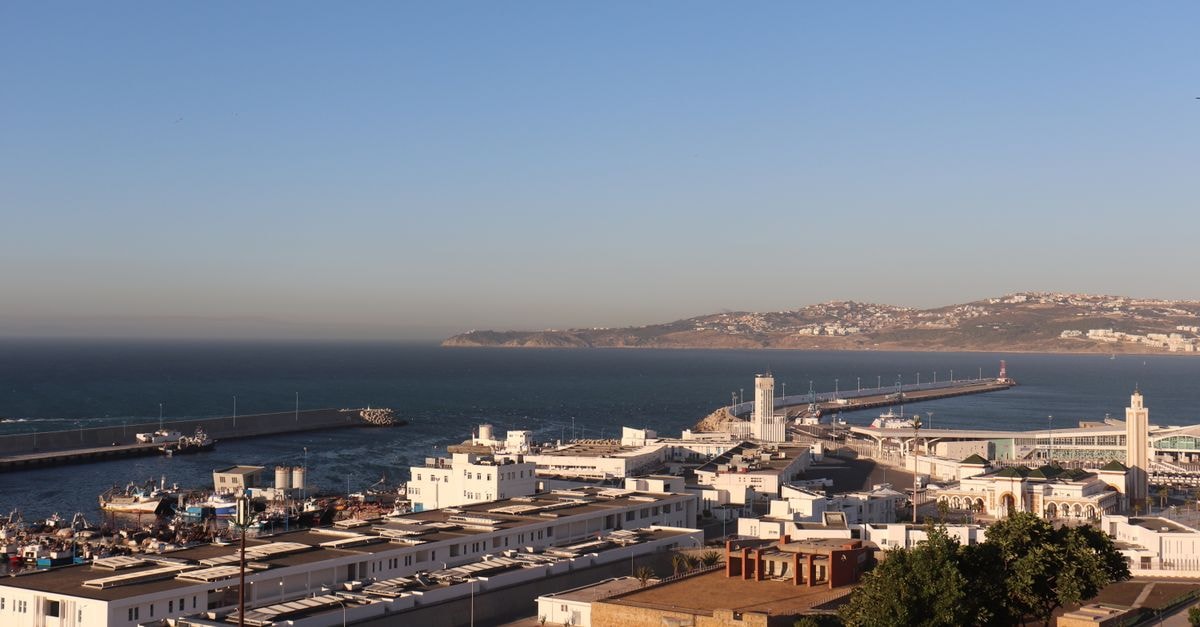 A captivating view of Tanger harbor with the ocean and city in the background.