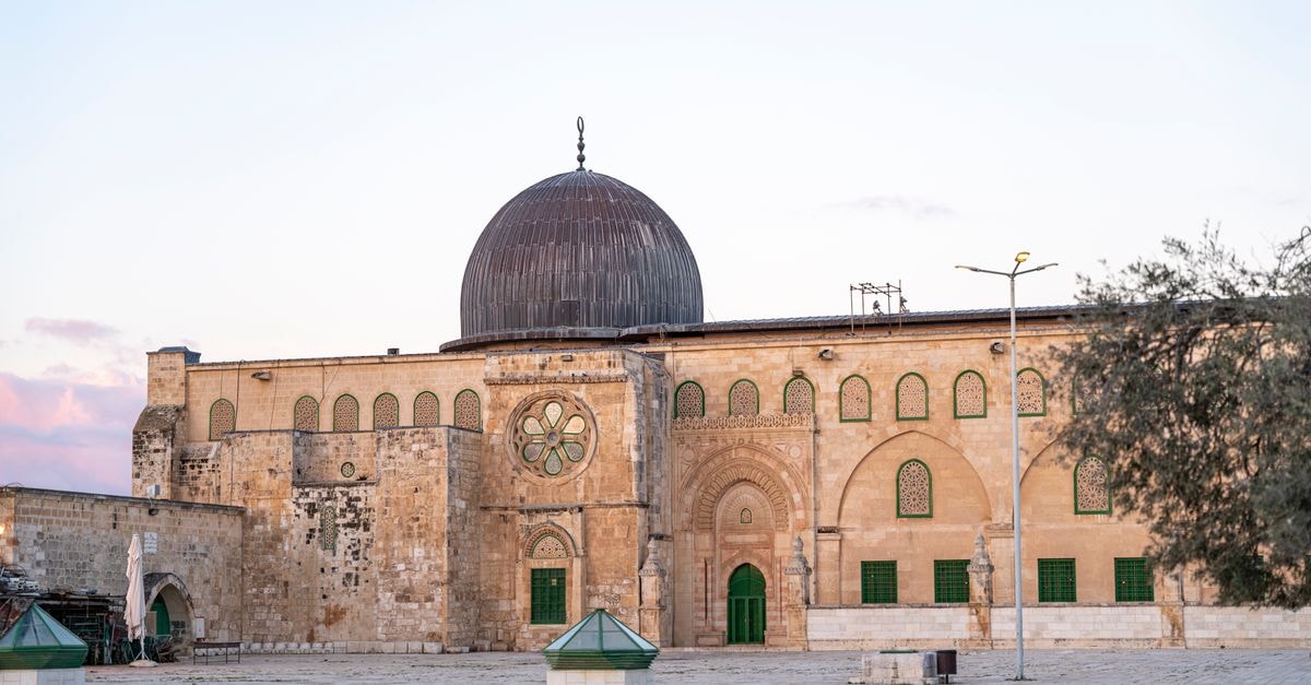 Beautiful view of Al-Aqsa Mosque's facade and dome in Jerusalem during dusk.
