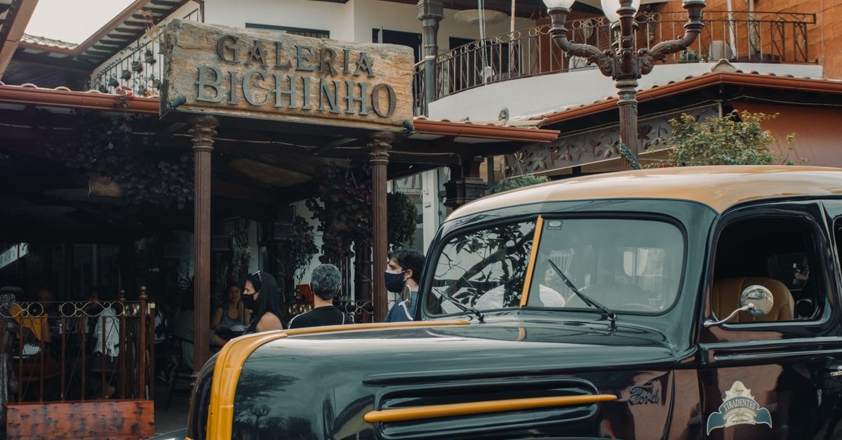 Hotel Galeria, Santiago de Veraguas — A Pan-American Highway Stop A classic vintage car parked outside Galeria Bichinho in a bustling street scene.