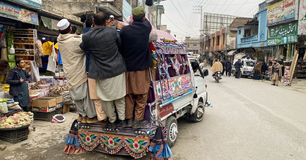 Dera Ismail Khan Travel Guide: A Slow Look at a Historic Crossroads Vibrant public transport scene in Mingora's bustling market showcases local culture and daily life.