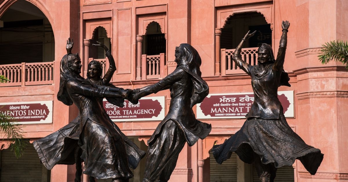 Patiala Travel Guide: Slow Sights, Punjabi Flavors, Easy Road Links Bronze statues depicting Punjabi women dancers in traditional attire outdoors.