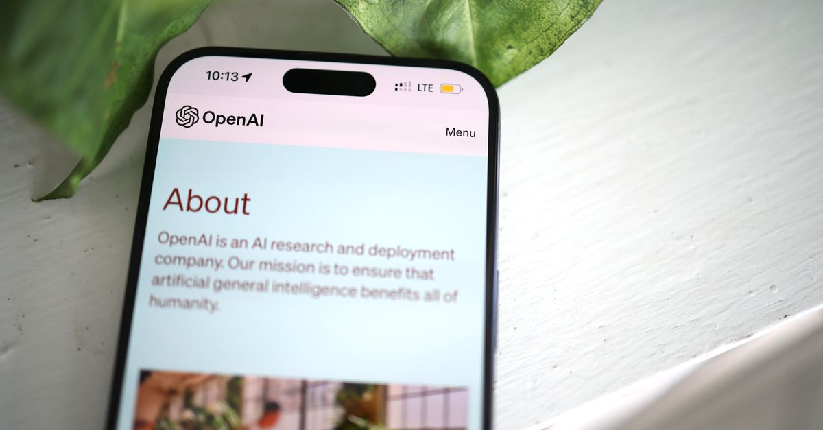 Musk calls for cross-lab pre-deployment review of frontier AI, says founding OpenAI accelerated the race Close-up shot of a smartphone screen showing the OpenAI website with greenery in the background.
