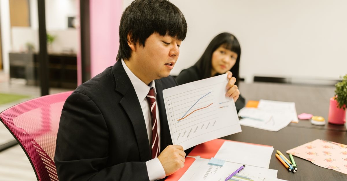 Samsung tells Fold 8 owners corner flex is intentional, not a defect Business professionals discussing data during a meeting in a modern office.