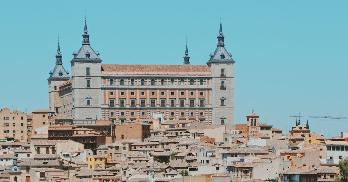 Scottwood Inn in Toledo: A Victorian Bed & Breakfast in the Old West End Panoramic view of the Alcazar of Toledo, a historical landmark in Spain.