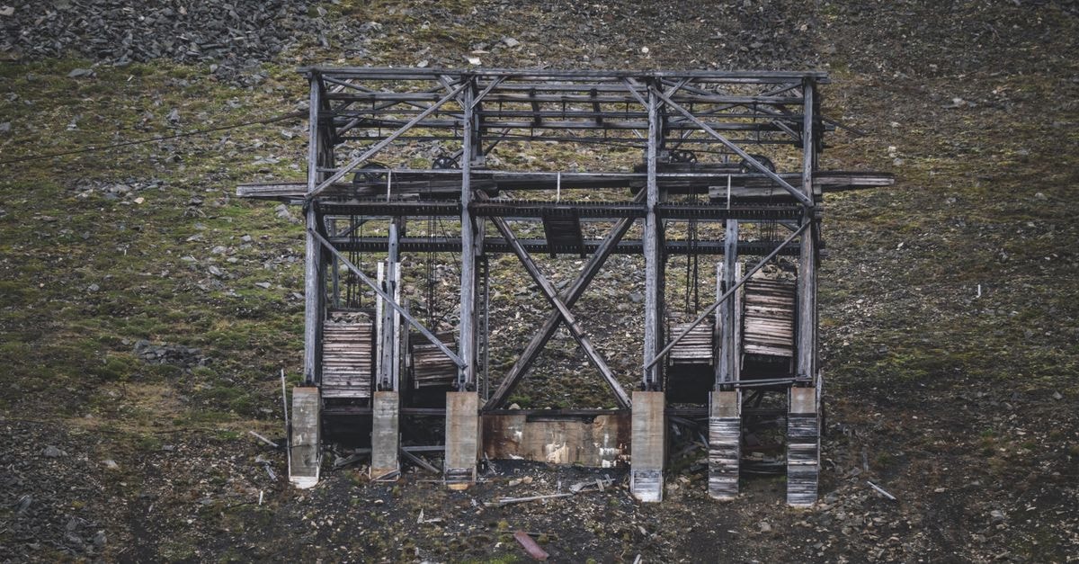 A Quiet Mining City on the Boreal Edge: Hegang Travel Guide Aerial view of an abandoned wooden structure in a rural mining area.