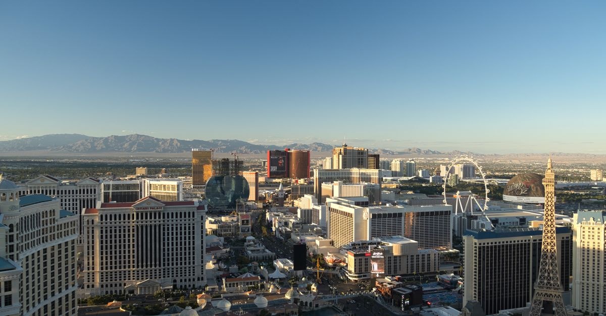 Las Vegas Travel Guide: Getting Around, Eating Well, and Seeing the Strip Stunning Las Vegas skyline at daybreak showcasing notable casinos and landmarks.
