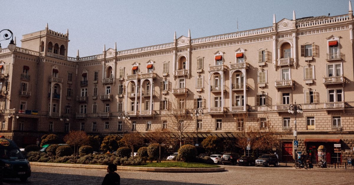 Chernivtsi travel guide: finding Ukraine's Little Vienna Elegant architectural facade of historic building in Tbilisi, showcasing Georgian urban landscape.