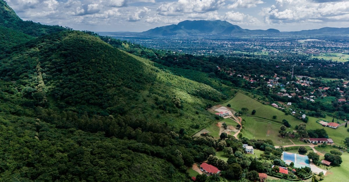 Blantyre Travel Guide: Malawi's Southern Gateway Scenic aerial view of the lush Morogoro Region, Tanzania, featuring sprawling greenery and distant mountains.
