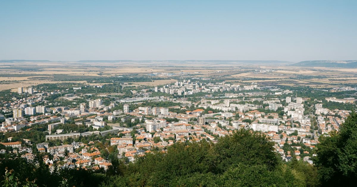 Hotel Transilvania in Alba Iulia: A 1972 City Landmark Aerial view of Varna showcasing cityscape with lush greenery and distant fields.