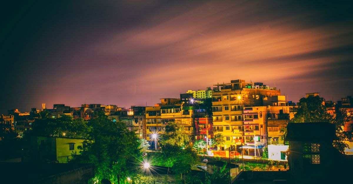 Ginger Agartala in Agartala: Airport-Road Convenience Colorful cityscape at night with illuminated buildings and vibrant sky, perfect for urban and travel themes.
