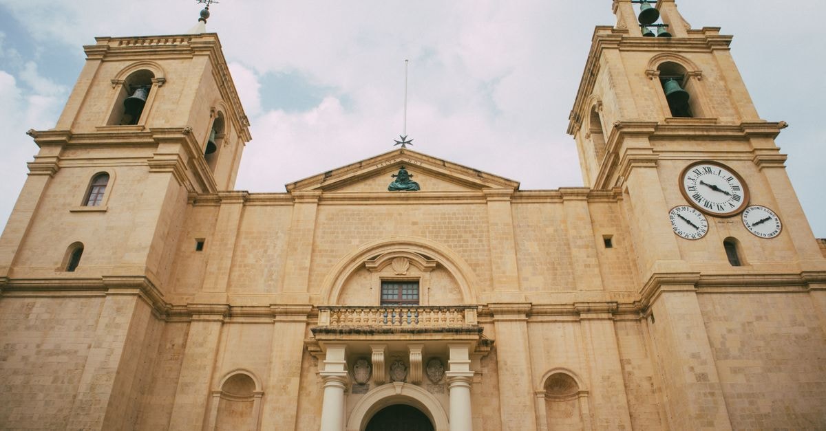 A St. Julian's Travel Guide for a Lively Malta Escape Impressive view of St. John's Co-Cathedral's facade in Valletta, Malta, showcasing Gothic architecture.