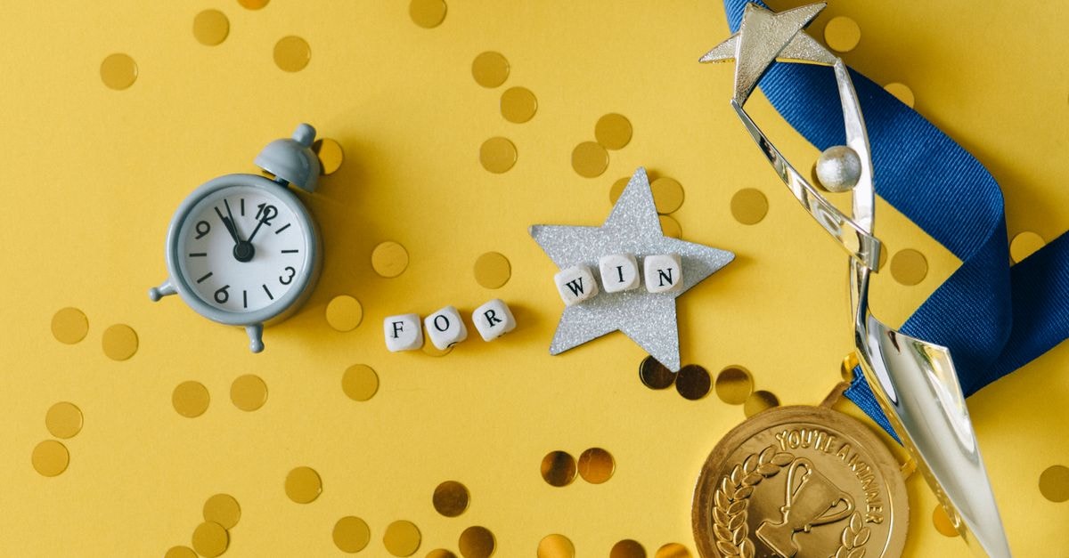 Japan's Shiho Kuwaki wins Women's British Open in play-off for first major Conceptual flat lay of a trophy, medal, and clock with 'FOR WIN' letters, symbolizing victory and achievement.
